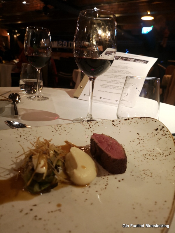 Image: Duck breast main course from James Martin Manchester with the accompanying red wine.